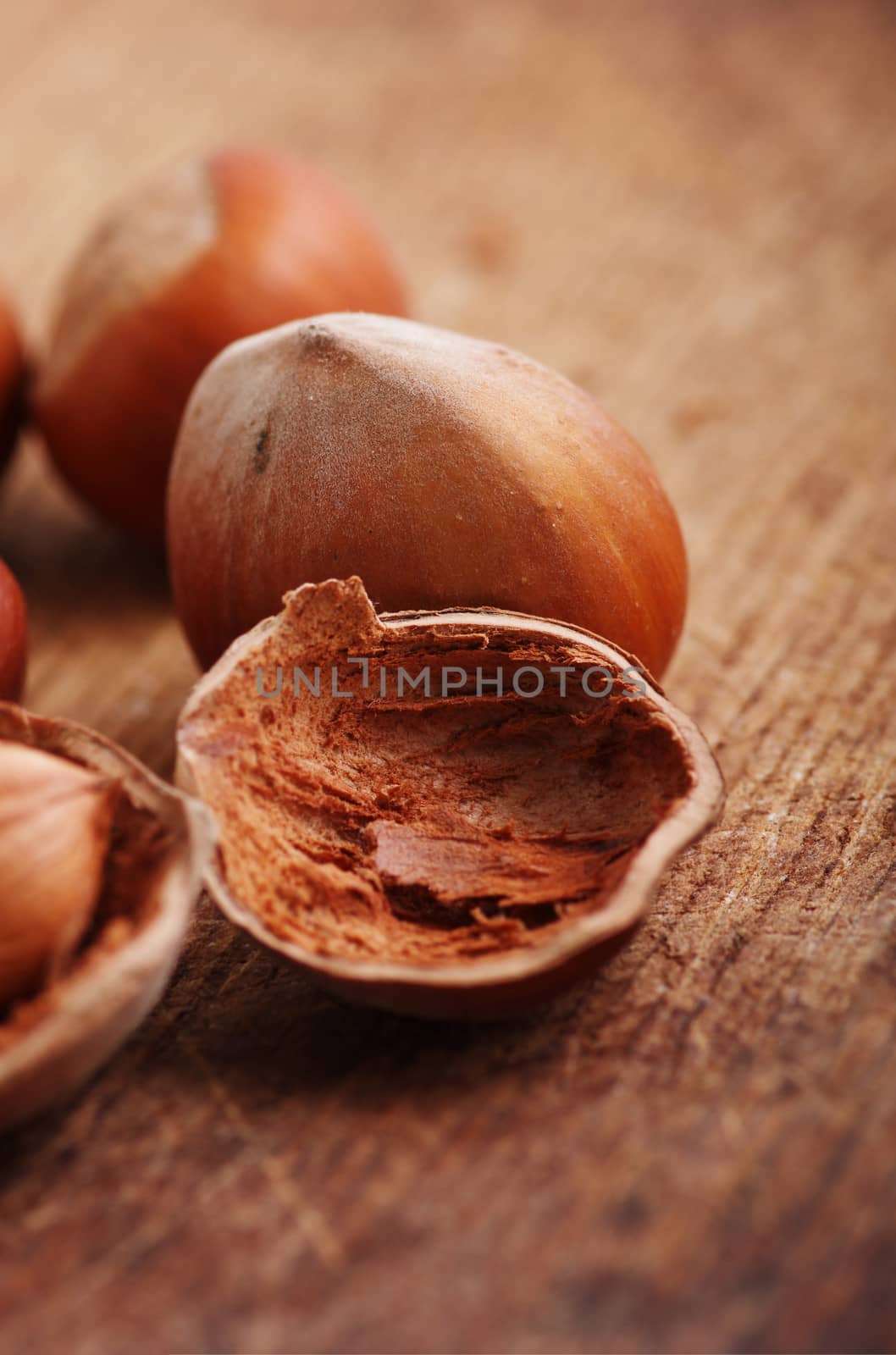 Hazelnuts, filbert on old wooden background 