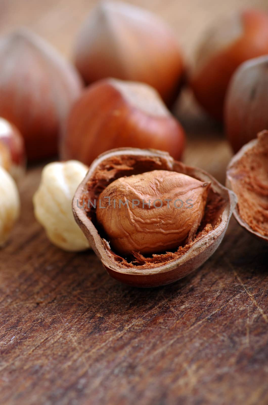 Hazelnuts, filbert on old wooden background 