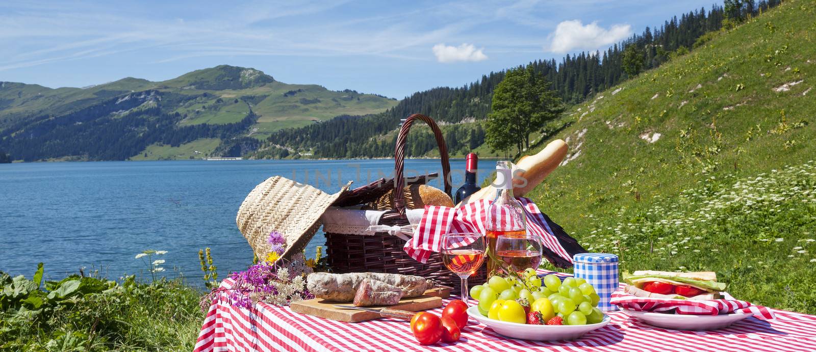 Picnic in french alps with lake, panoramic view