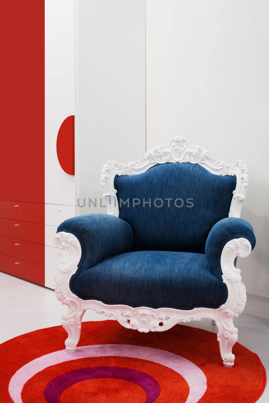 Armchair with a jeans fabric in a modern apartment
