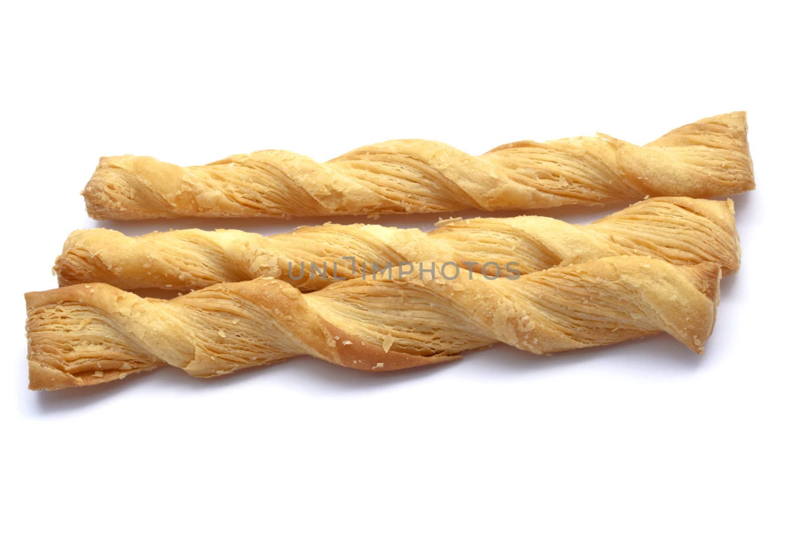 Butter salted twists closeup on white background