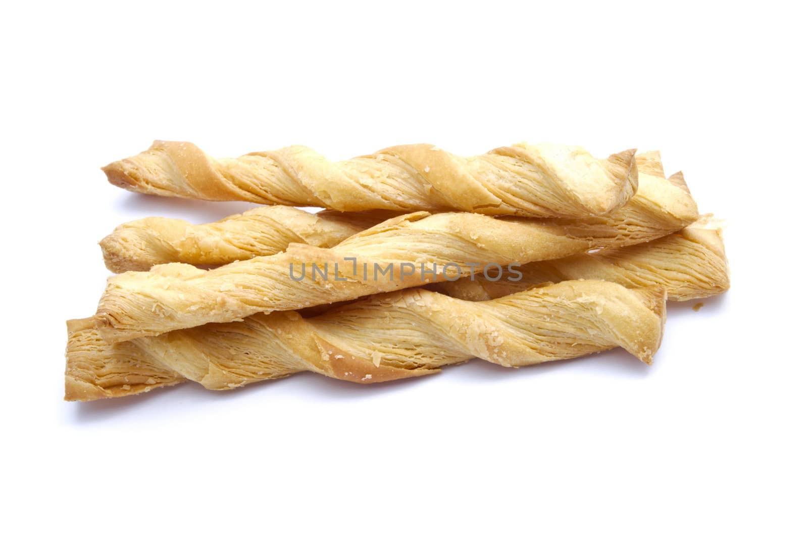 Butter salted twists closeup on white background