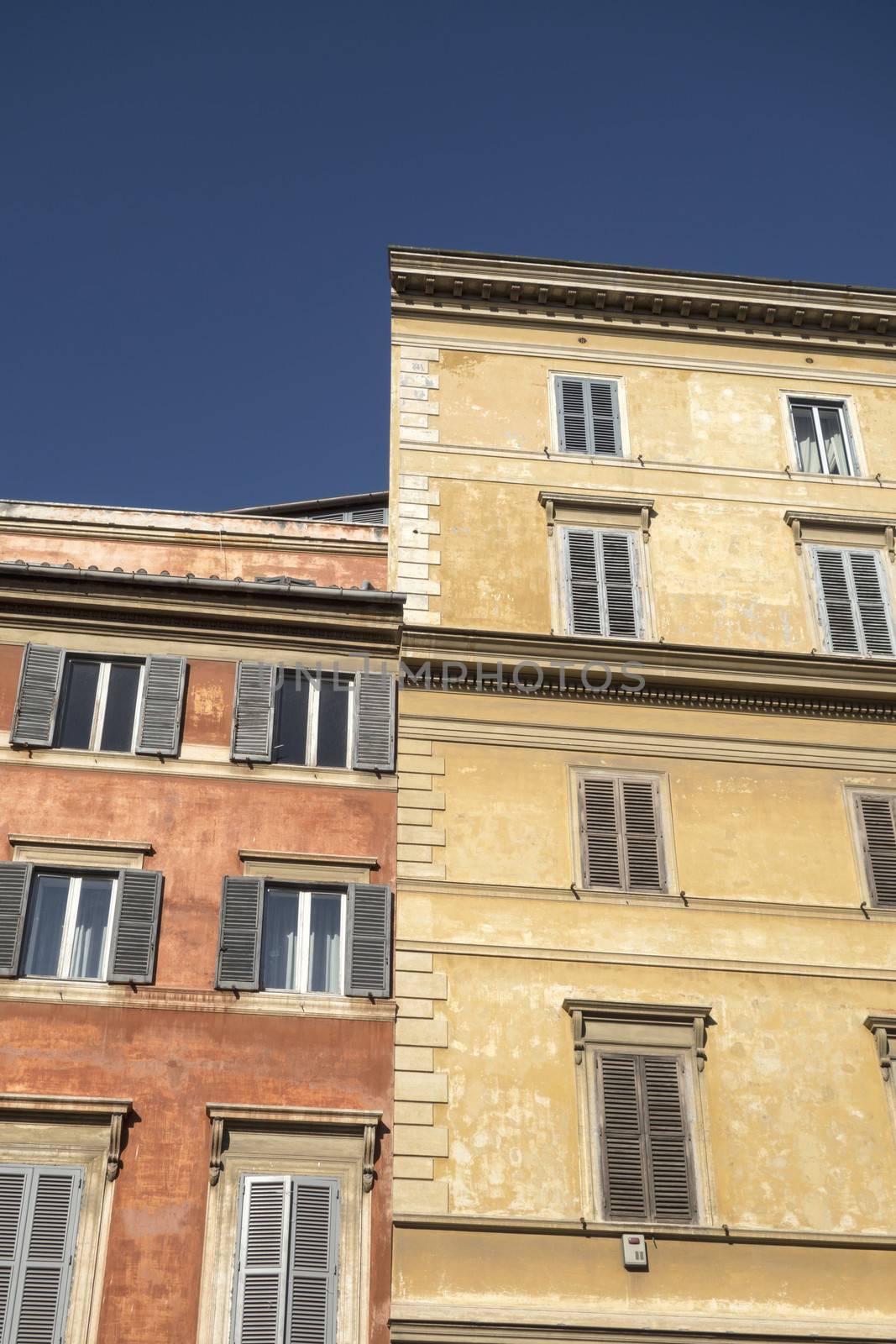 Windows of old buildings in Rome
