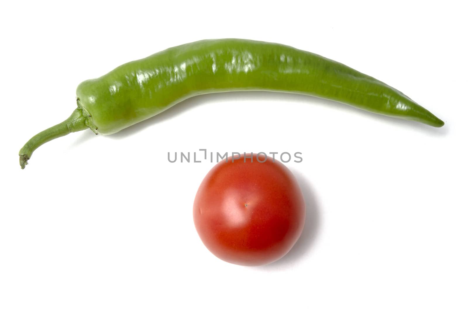Red tamato and green pepper closeup on white background