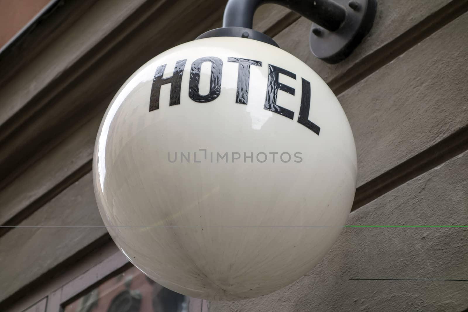 Hotel sign on the street lamp