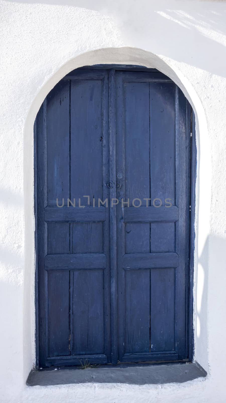 Blue door and white house in Santorini, Greece