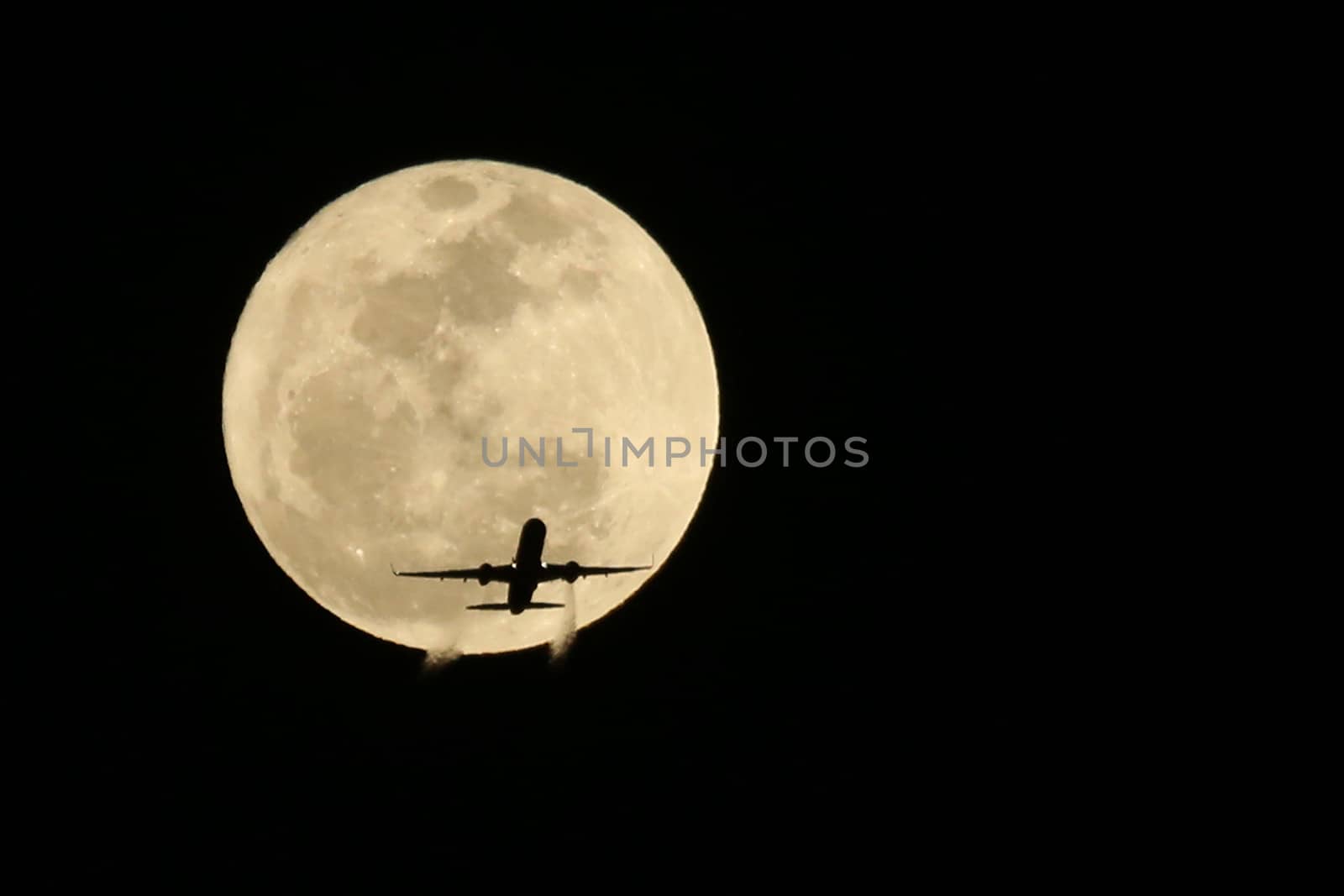 Jet Airplane Passing in front of a Full Moon- Real not Digitally by tobkatrina