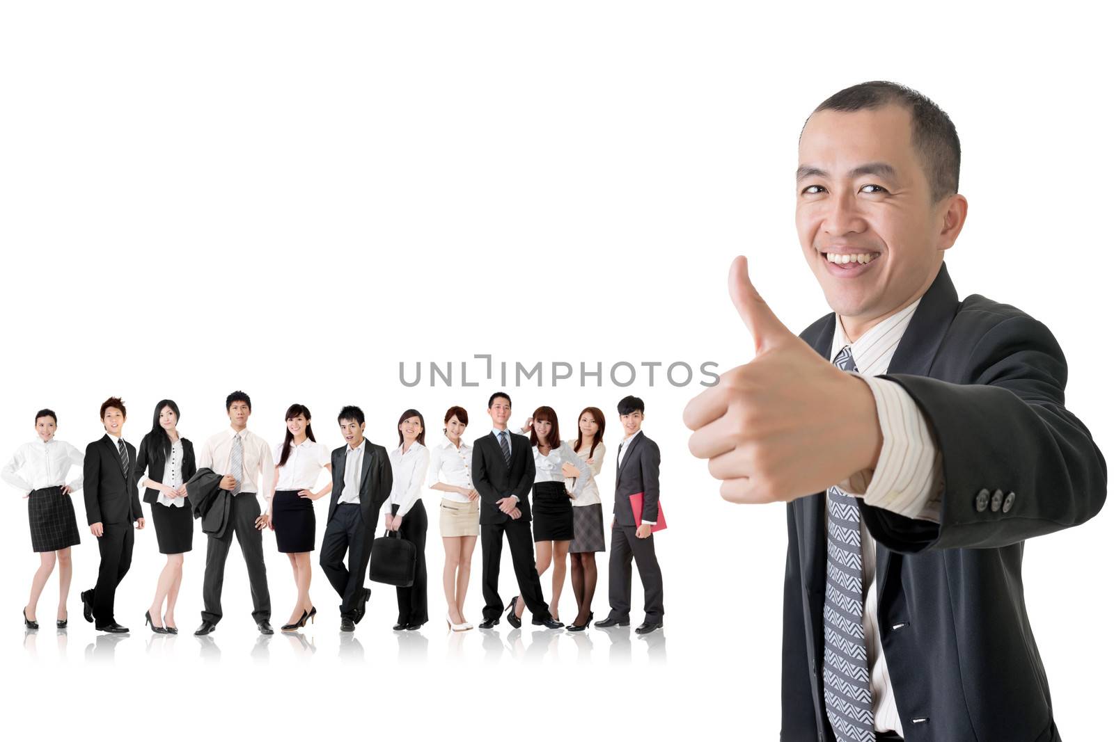 Mature businessman give you a gesture of excellent and standing in front of his team on studio white background.
