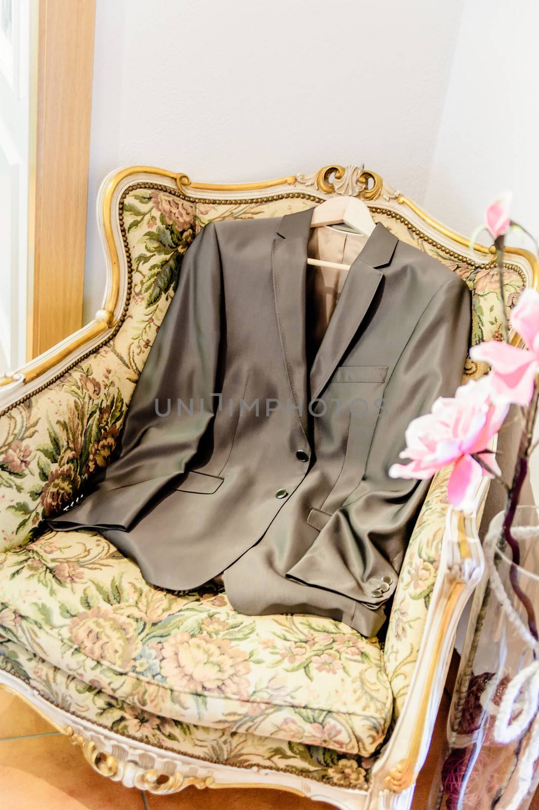 Grooms suit jacket lying on a seat