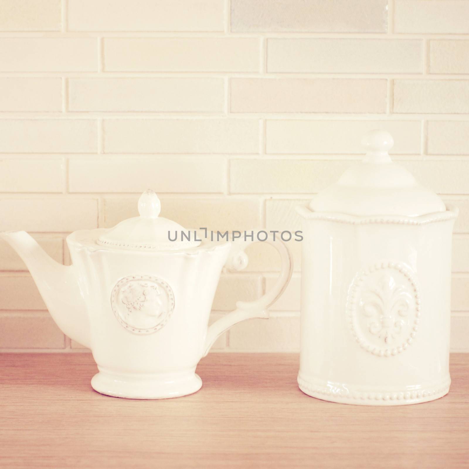 Classic porcelain teapot and jar with retro filter effect by nuchylee