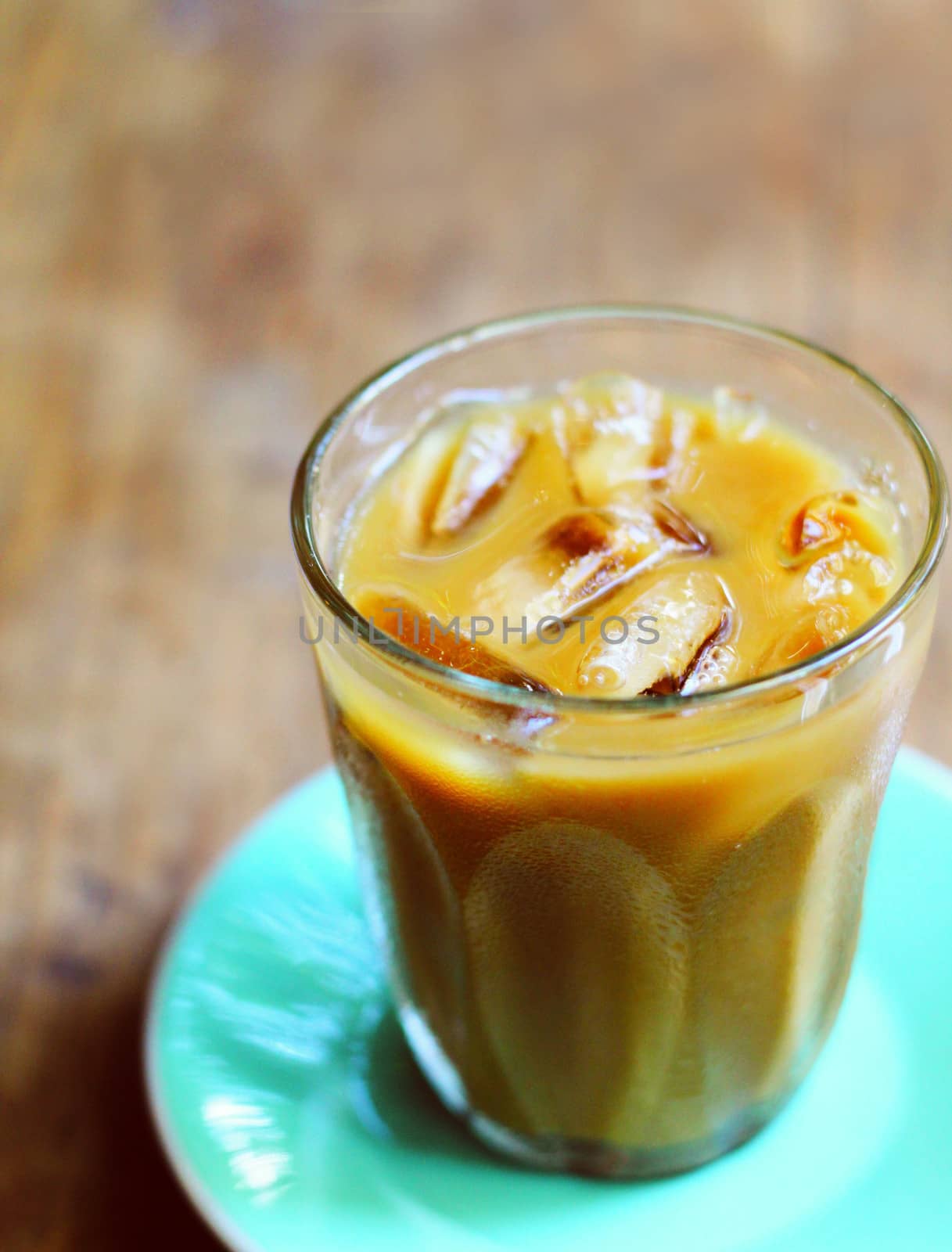 Iced coffee on wooden table