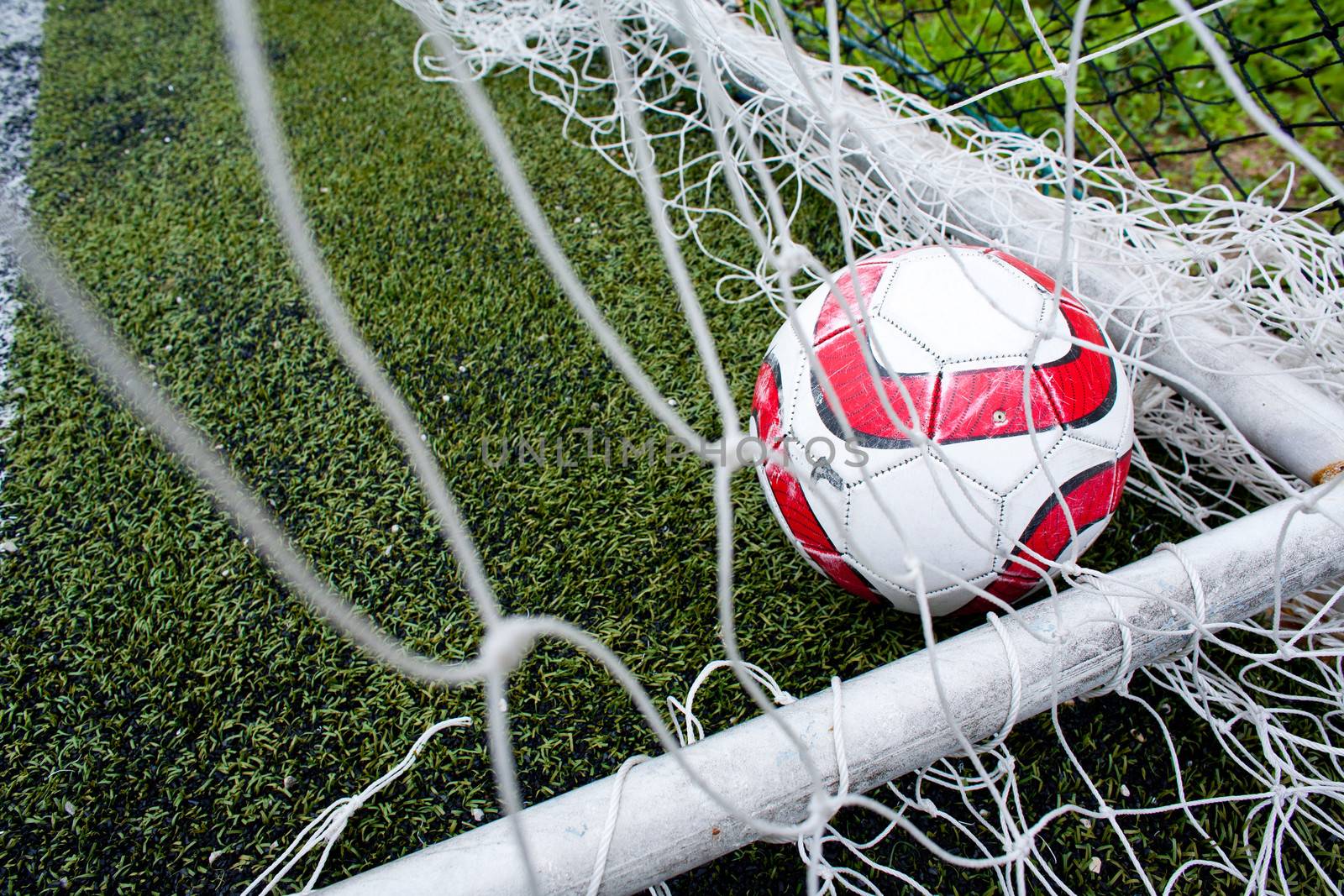 Football in the goal net by 2nix