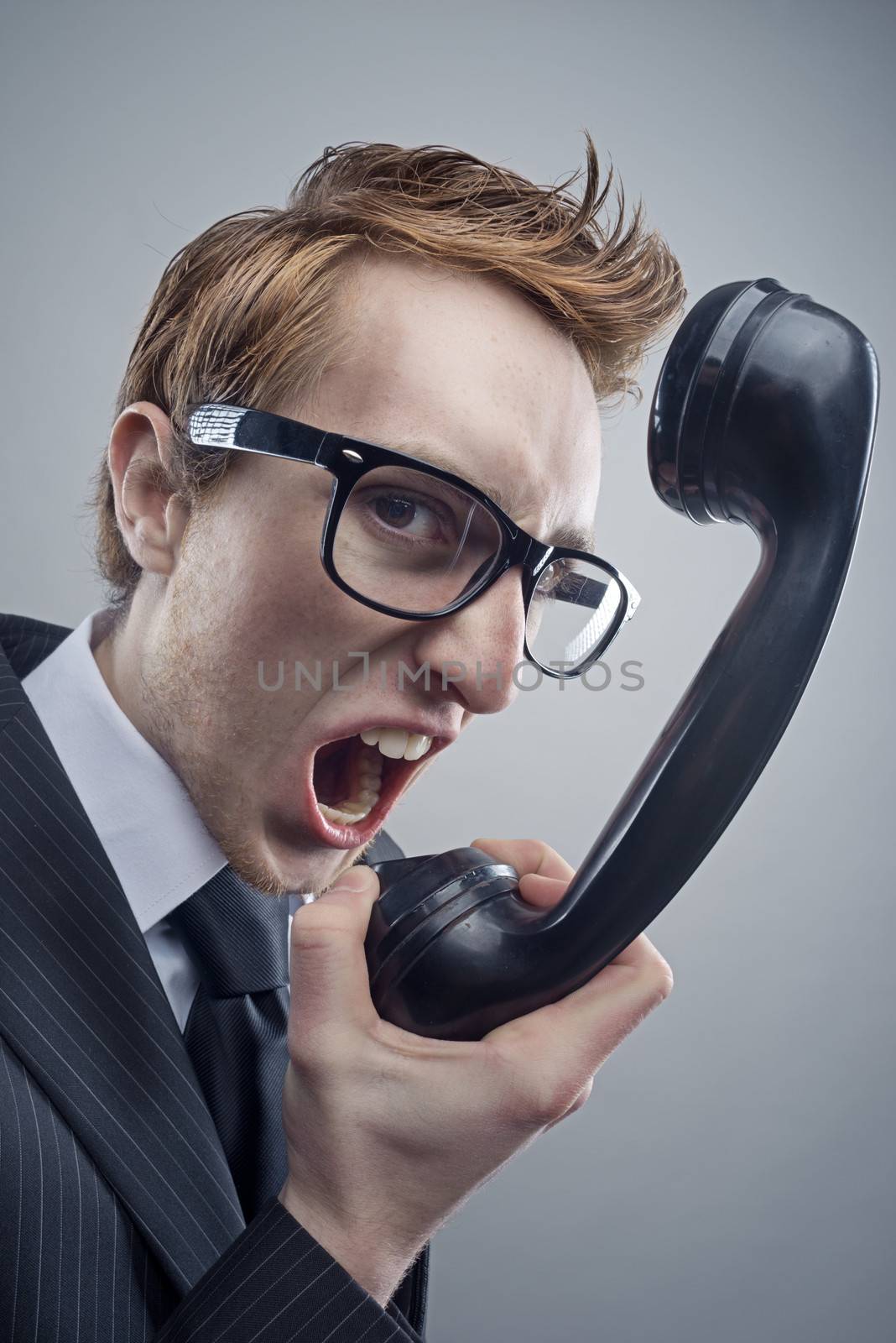 Angry nerd businessman retro telephone call shouting