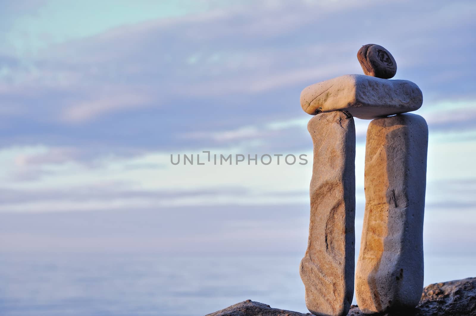 Balancing of elongated stones on the coast