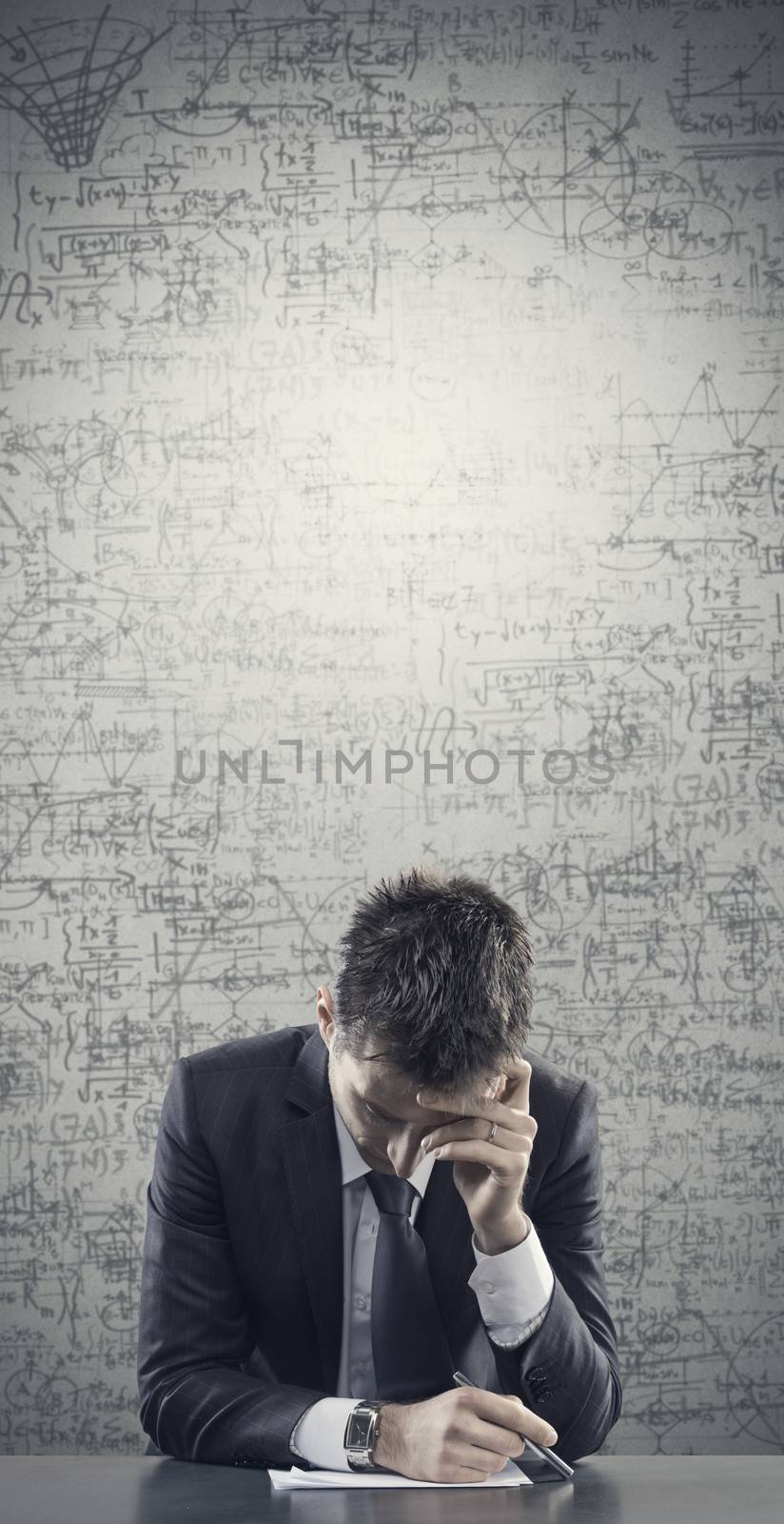 Pensive business man at their desk, copy space