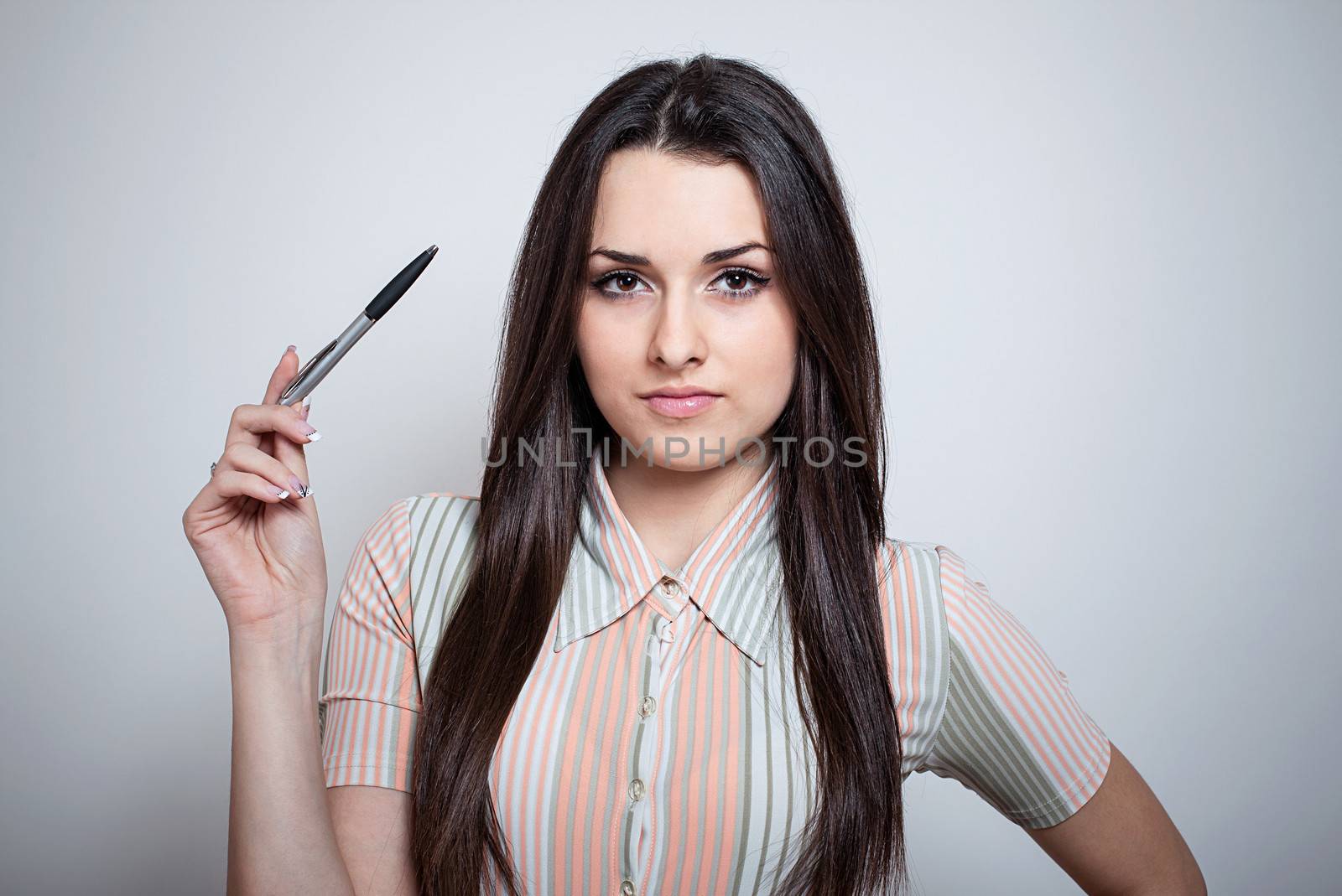 Beautiful young business woman with pencil by uros93