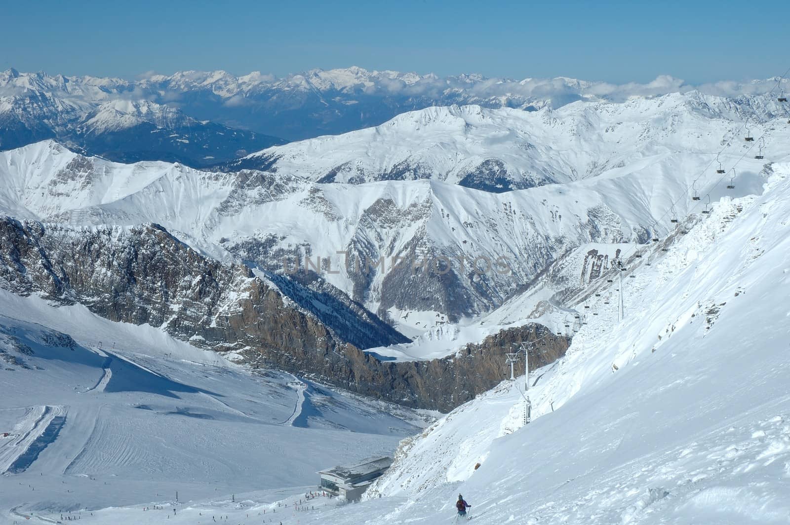 Ski slopes and ski lift on Hintertux glacier in Alps nearby Zillertal valley in Austria