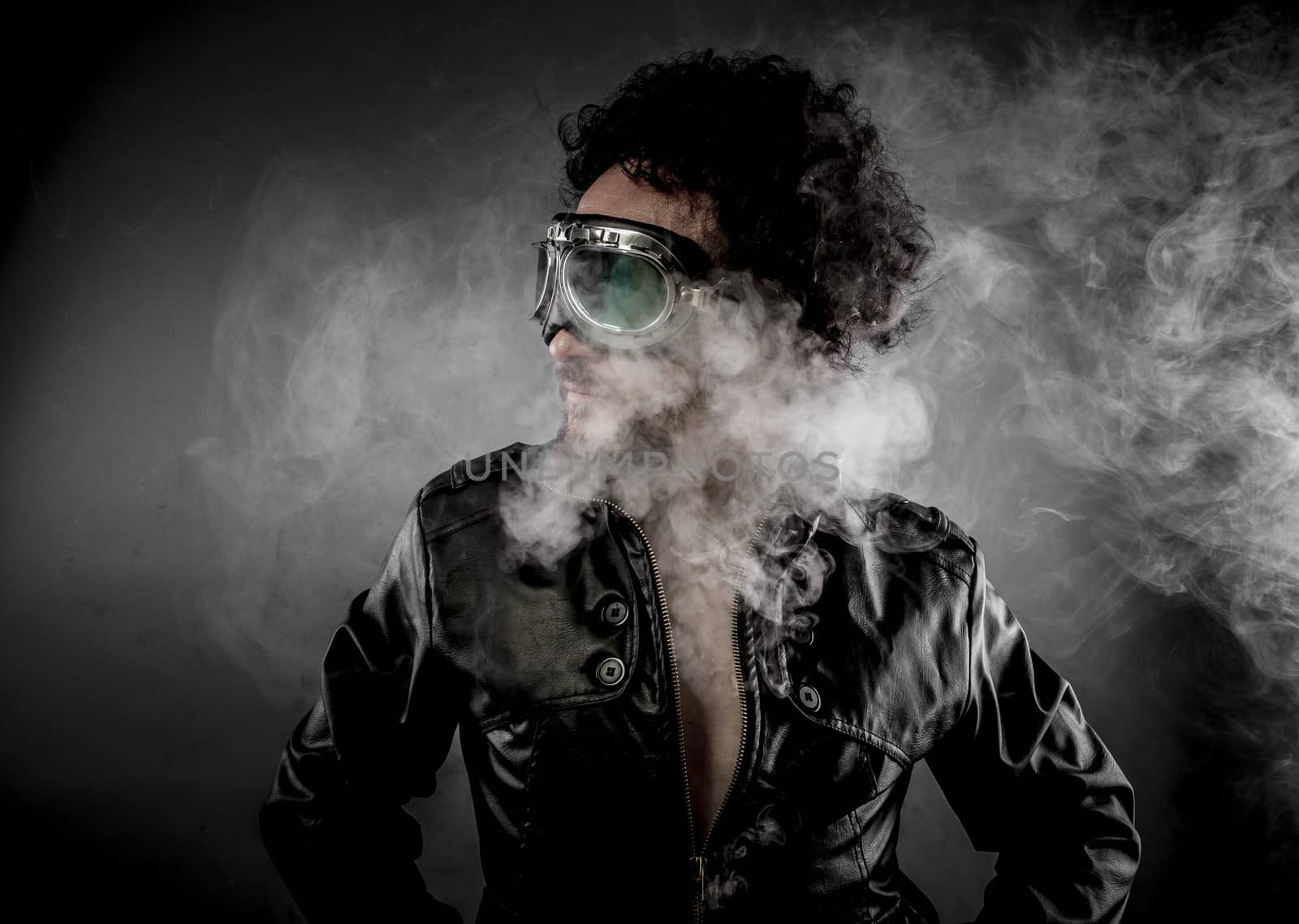 Driver, biker with sunglasses era dressed Leather jacket, huge smoke over dark background