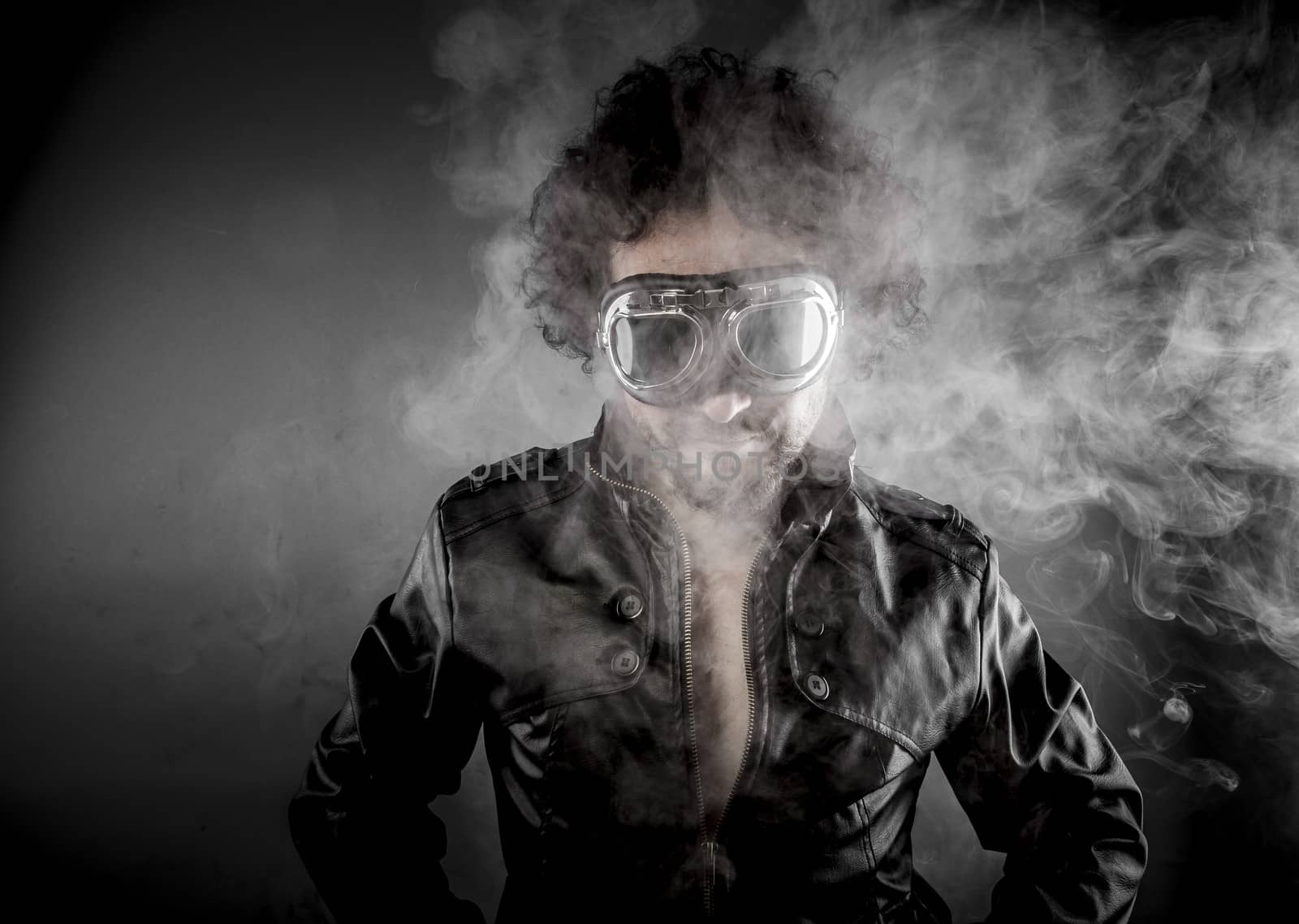 Driver, biker with sunglasses era dressed Leather jacket, huge smoke over dark background