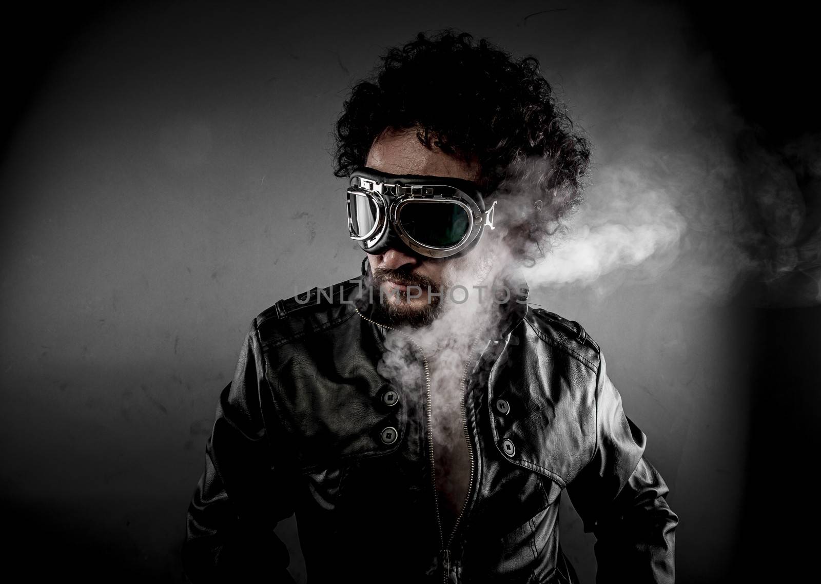 Speed, biker with sunglasses era dressed Leather jacket, huge smoke over dark background