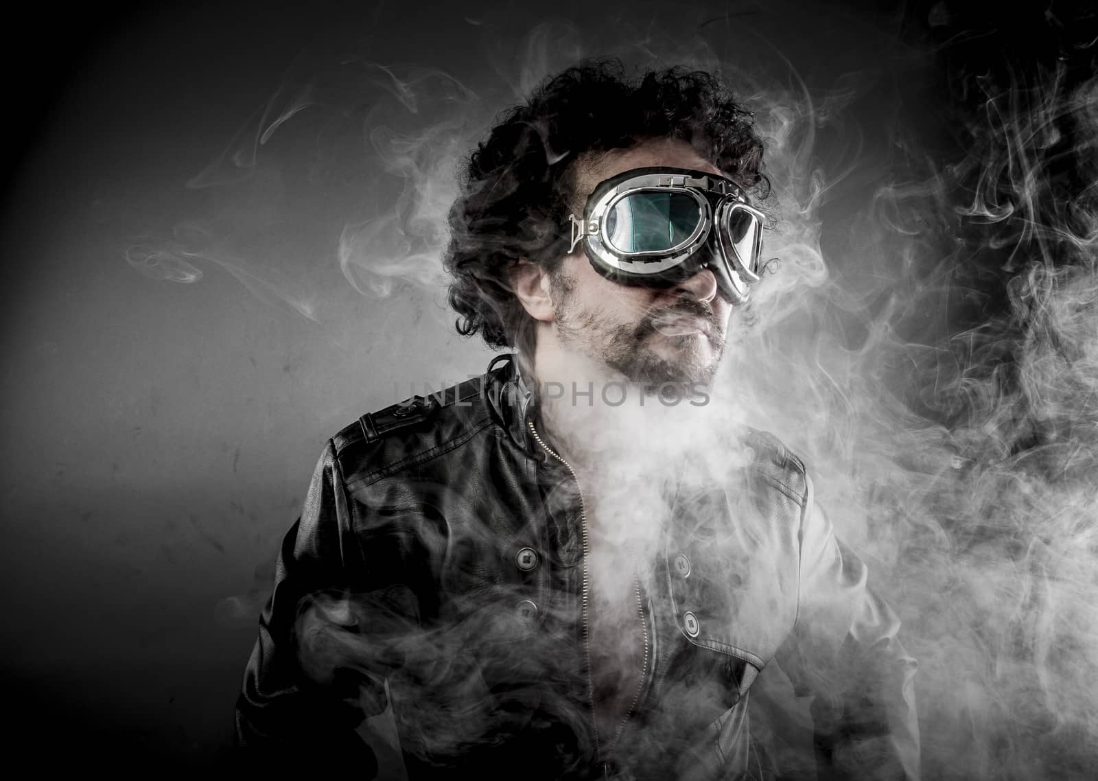 Power, biker with sunglasses era dressed Leather jacket, huge smoke over dark background