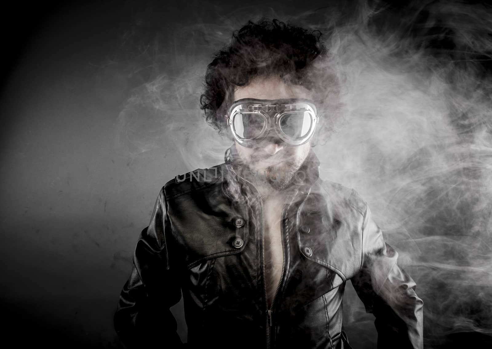 Motorcyclist, biker with sunglasses era dressed Leather jacket, huge smoke over dark background