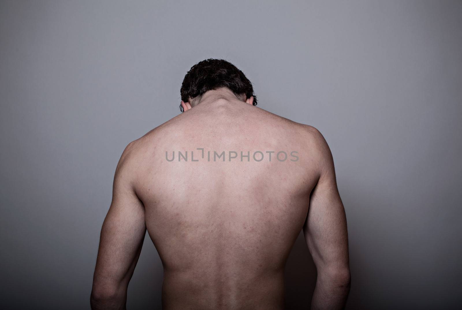 Male back over gray background by uros93