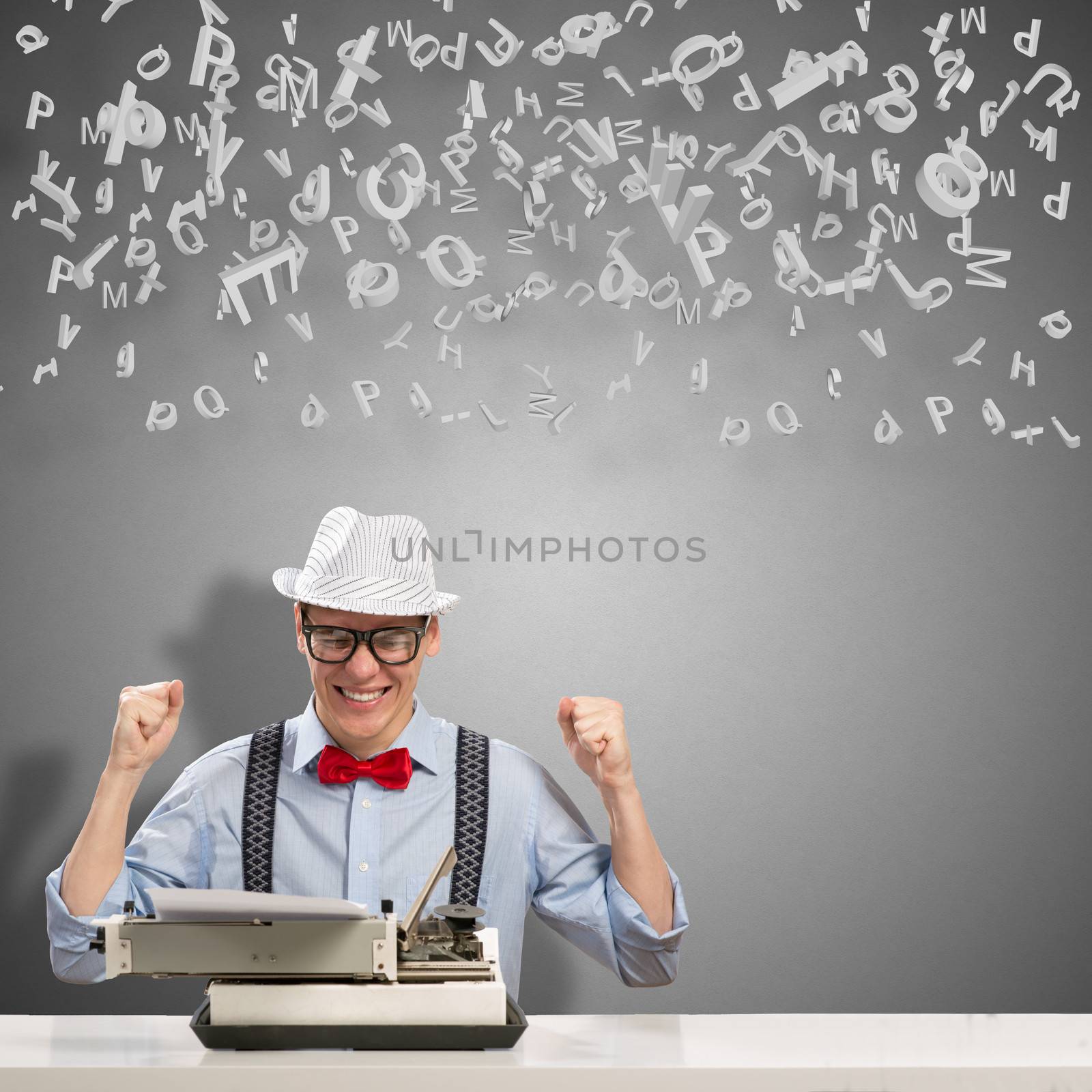 image of a young journalist, sitting at the table for a typewriter