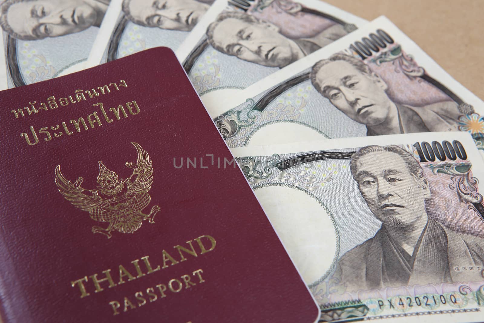 Thailand passport and Japanese Yen money