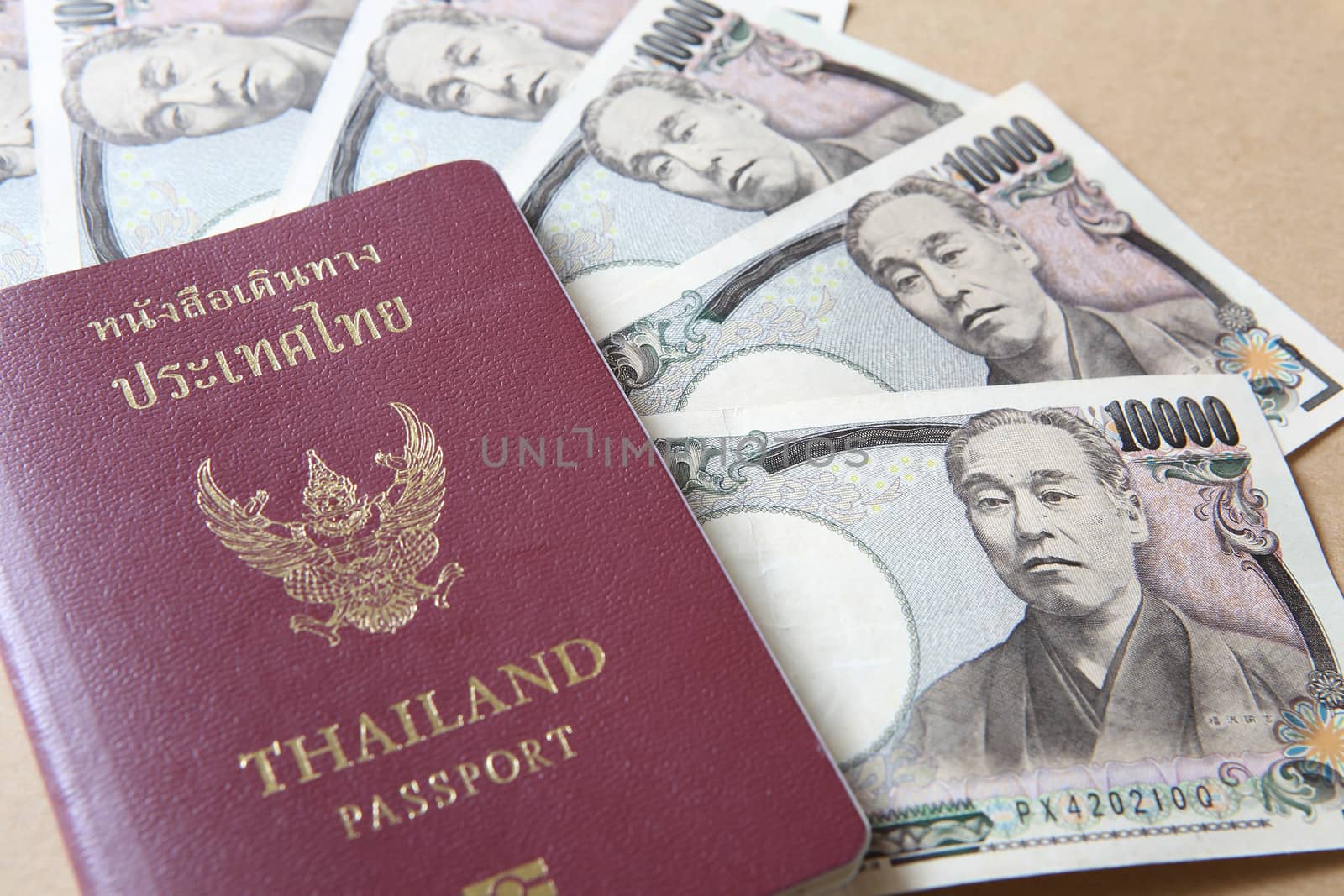 Thailand passport and Japanese Yen money