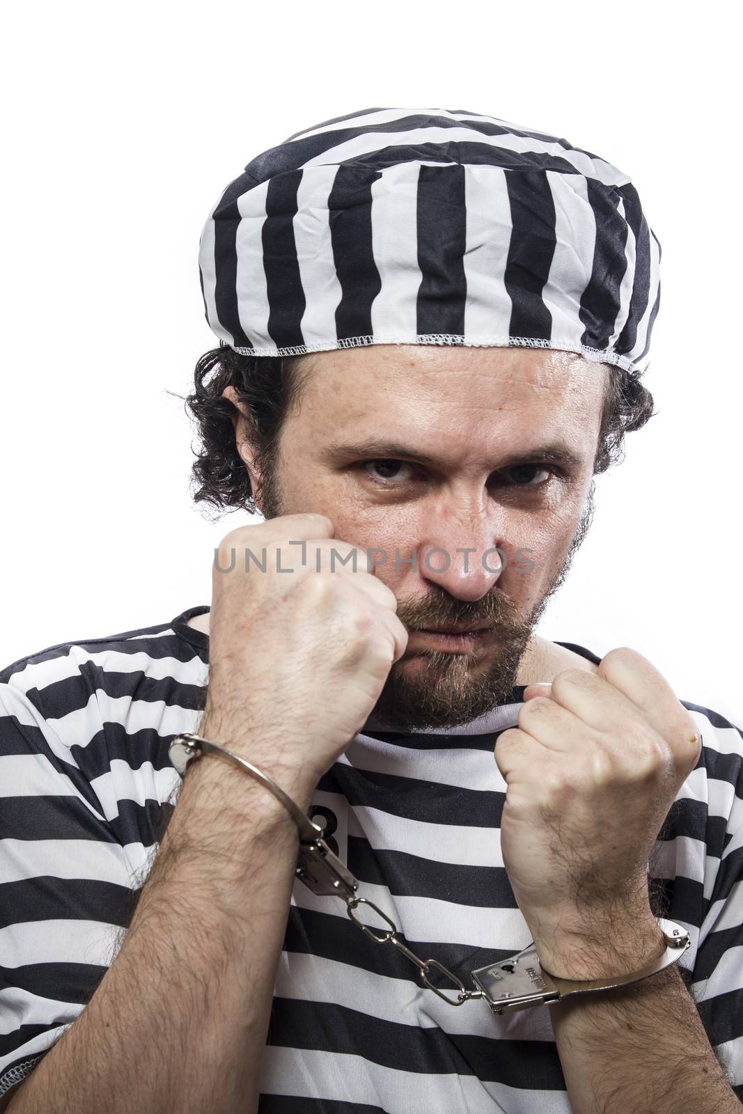 Desperate, portrait of a man prisoner in prison garb, over white by FernandoCortes