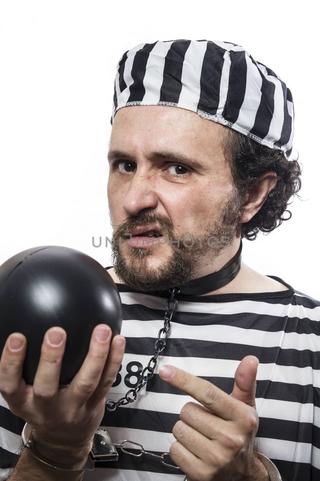 Solution, one caucasian man prisoner criminal with chain ball and handcuffs in studio isolated on white background