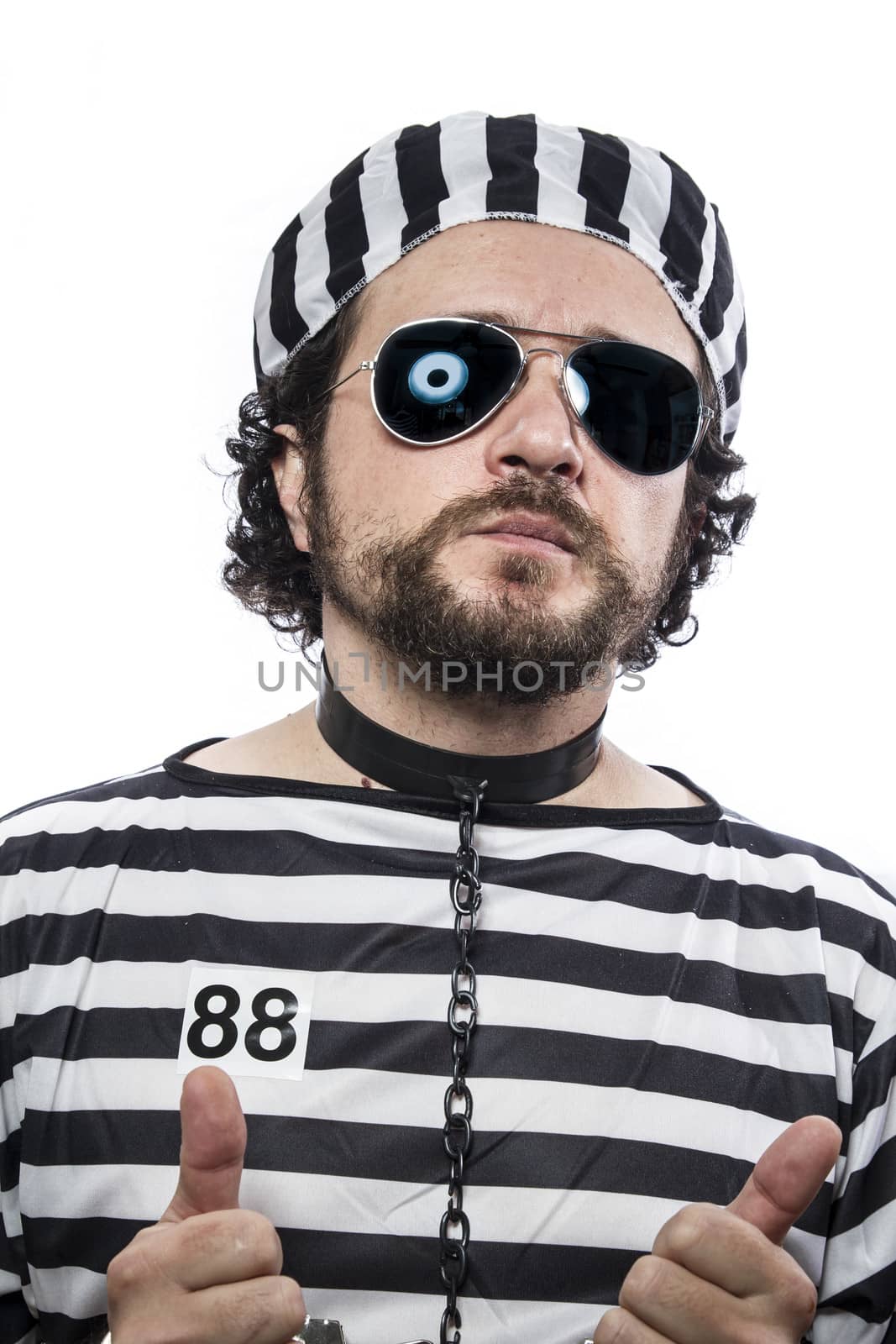 Prison, one caucasian man prisoner criminal with chain ball and handcuffs in studio isolated on white background