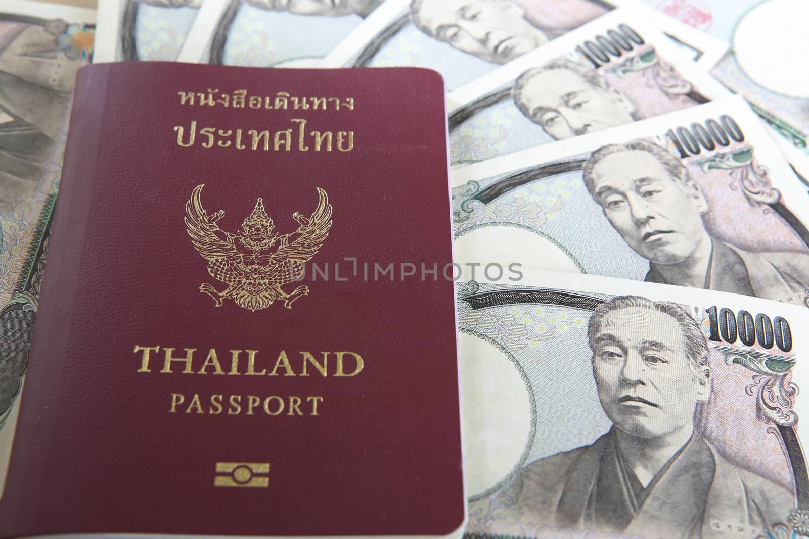 Thailand passport and Japanese Yen money by rufous