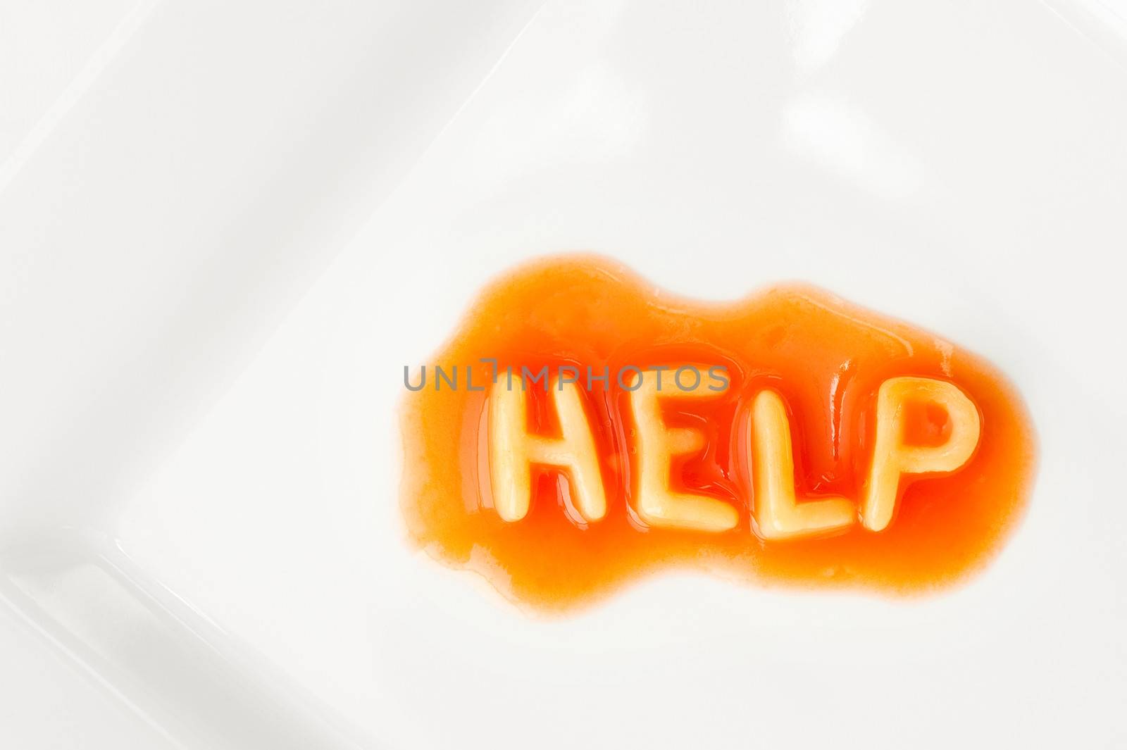 help message written in pasta letters on a white square plate