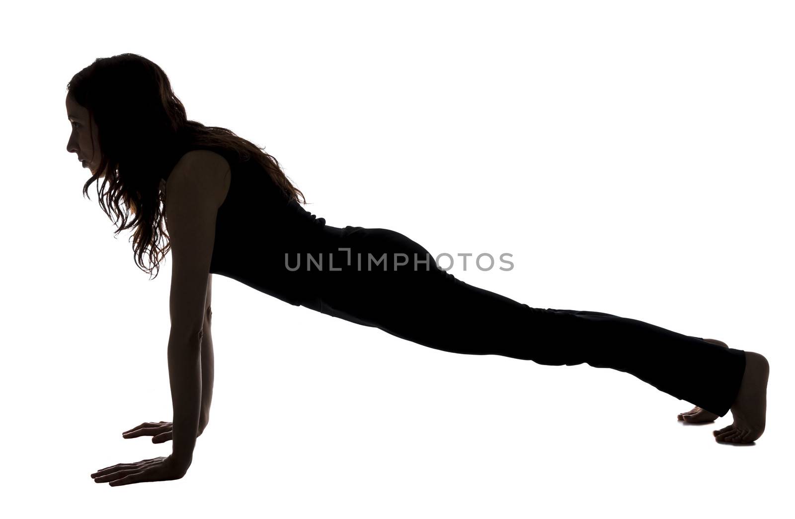 Young woman is doing Plank Pose in Yoga.