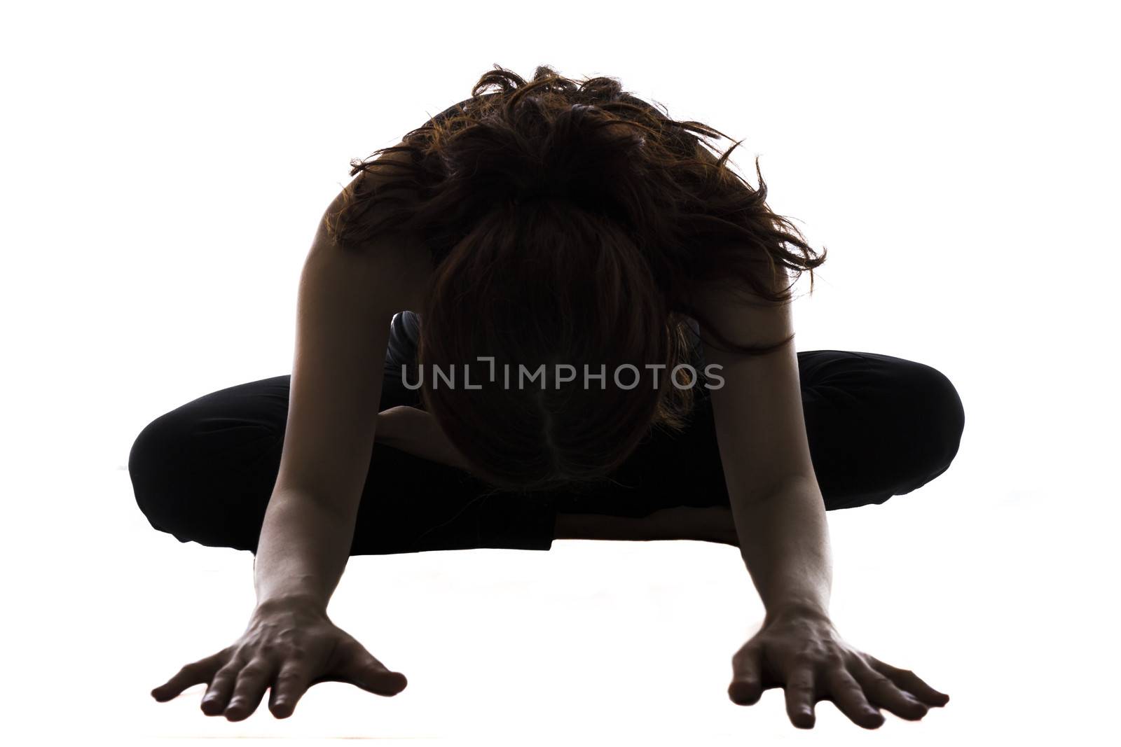 Woman is doing Bound Angle Pose in Yoga.