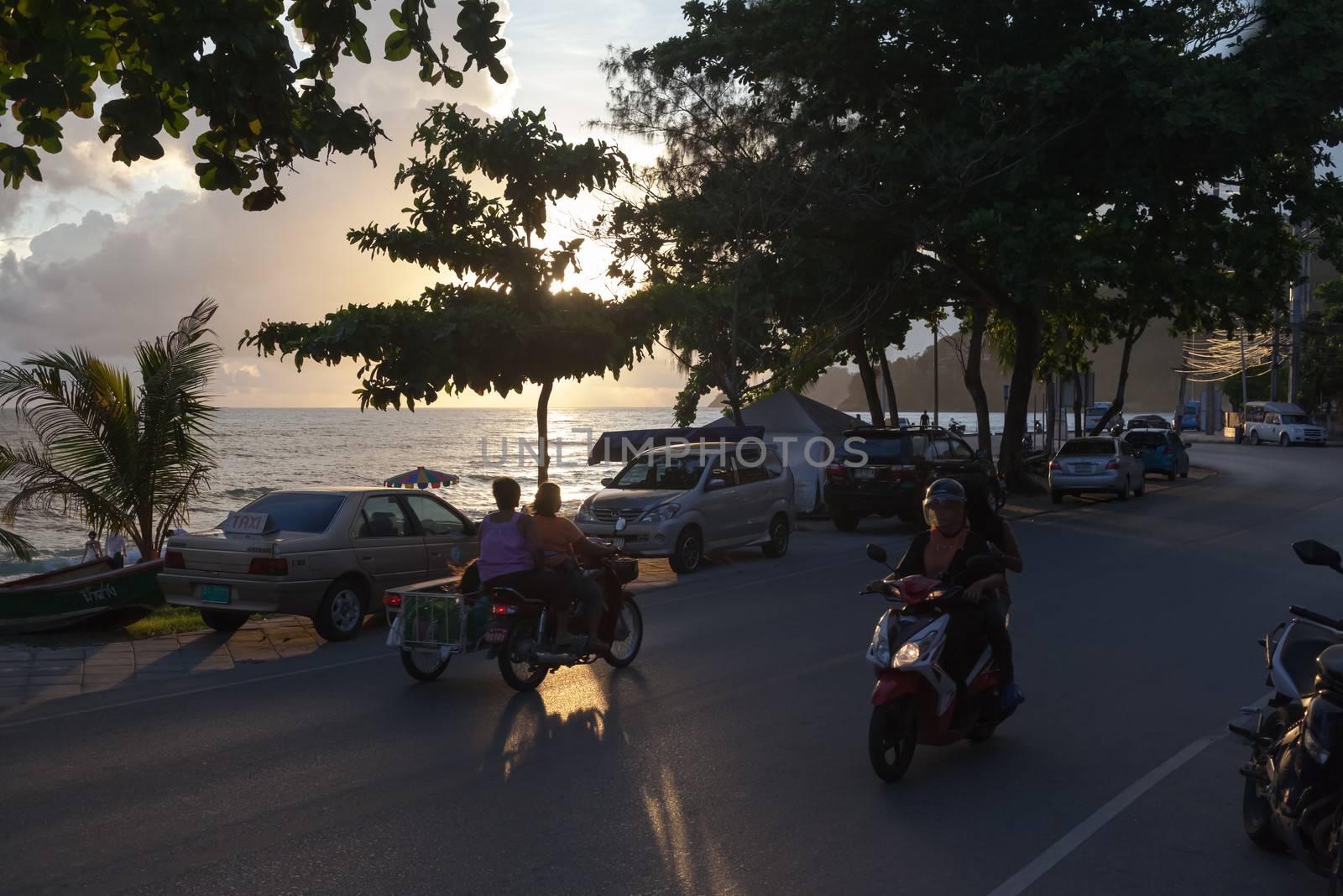 Patong - MAY 01: Thai womans riding on motorcycles. MAY 01, 2012 Street in Patong, Thailand. Traditionally transport in Asia 