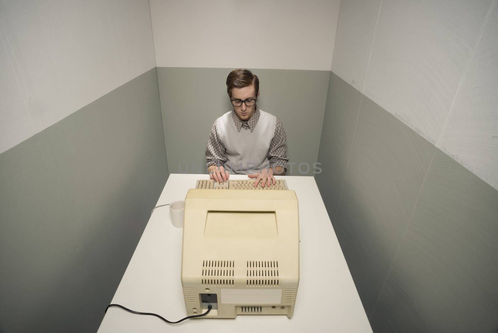 Vintage nerd on computer by stokkete