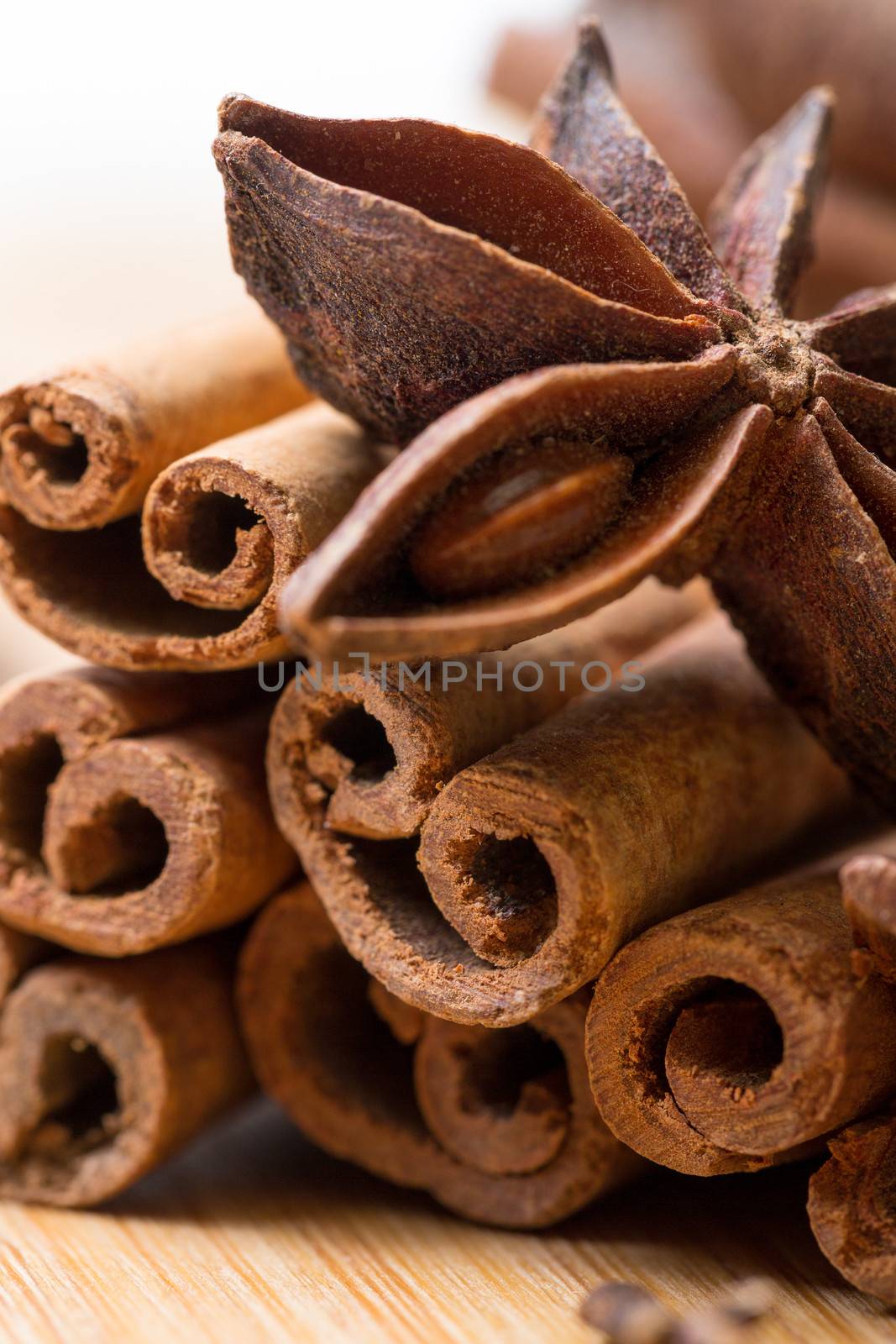 Dry multicolored spice closeup on wooden background