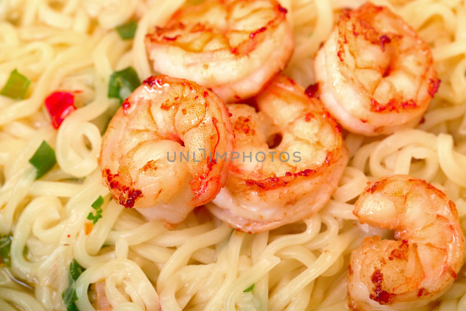 Fried shrimp and noodle soup bowl closeup