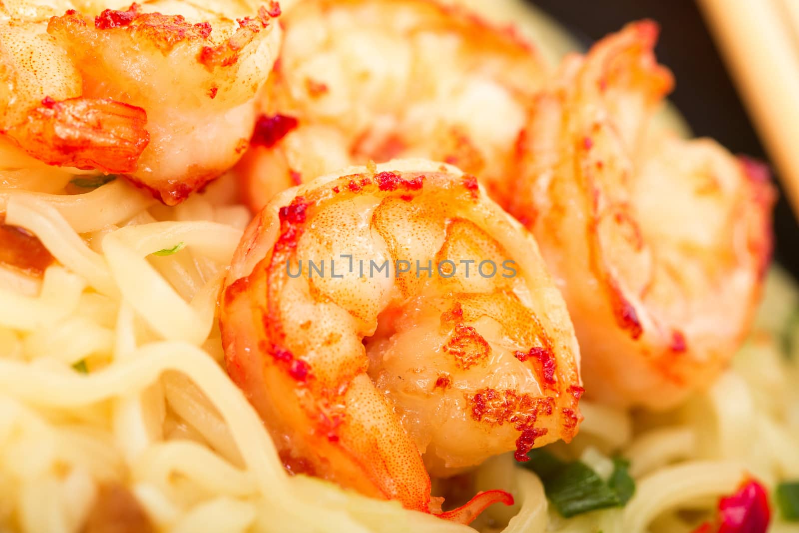 Fried shrimp and noodle soup bowl closeup
