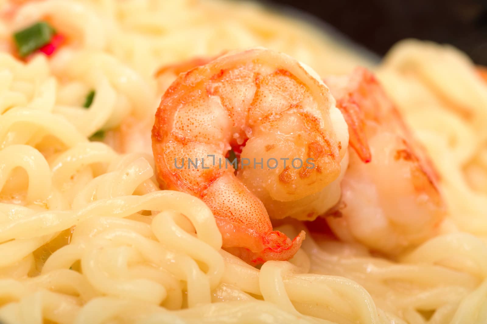 Fried shrimp and noodle soup bowl closeup