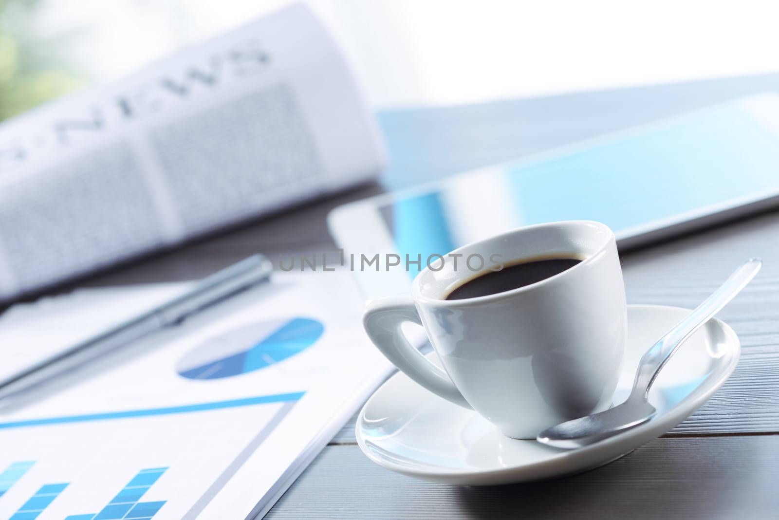 Business Office scene, coffee, documents and digital tablet on desk