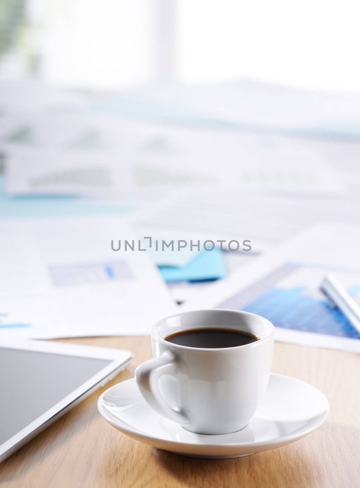 Business Office scene, documents and coffee on desk
