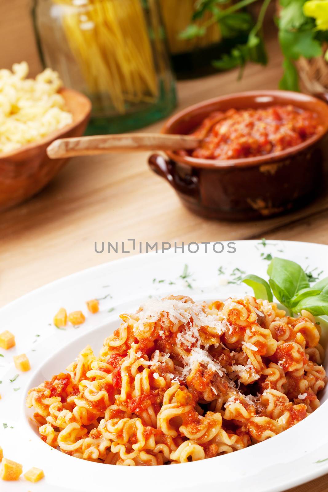 Italian food: pasta with tomato sauce and parmesan cheese.