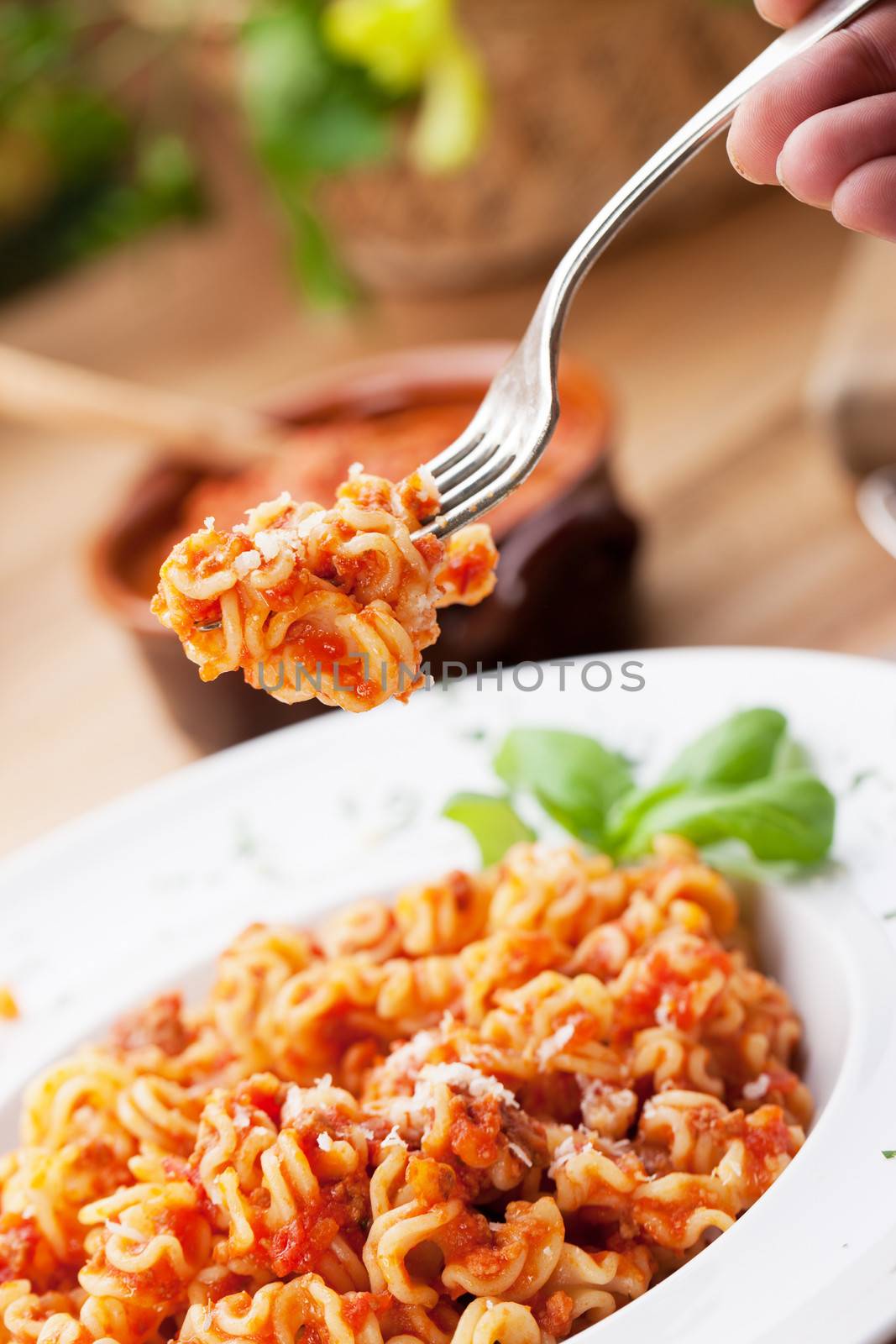 Italian food: pasta with tomato sauce and parmesan cheese.