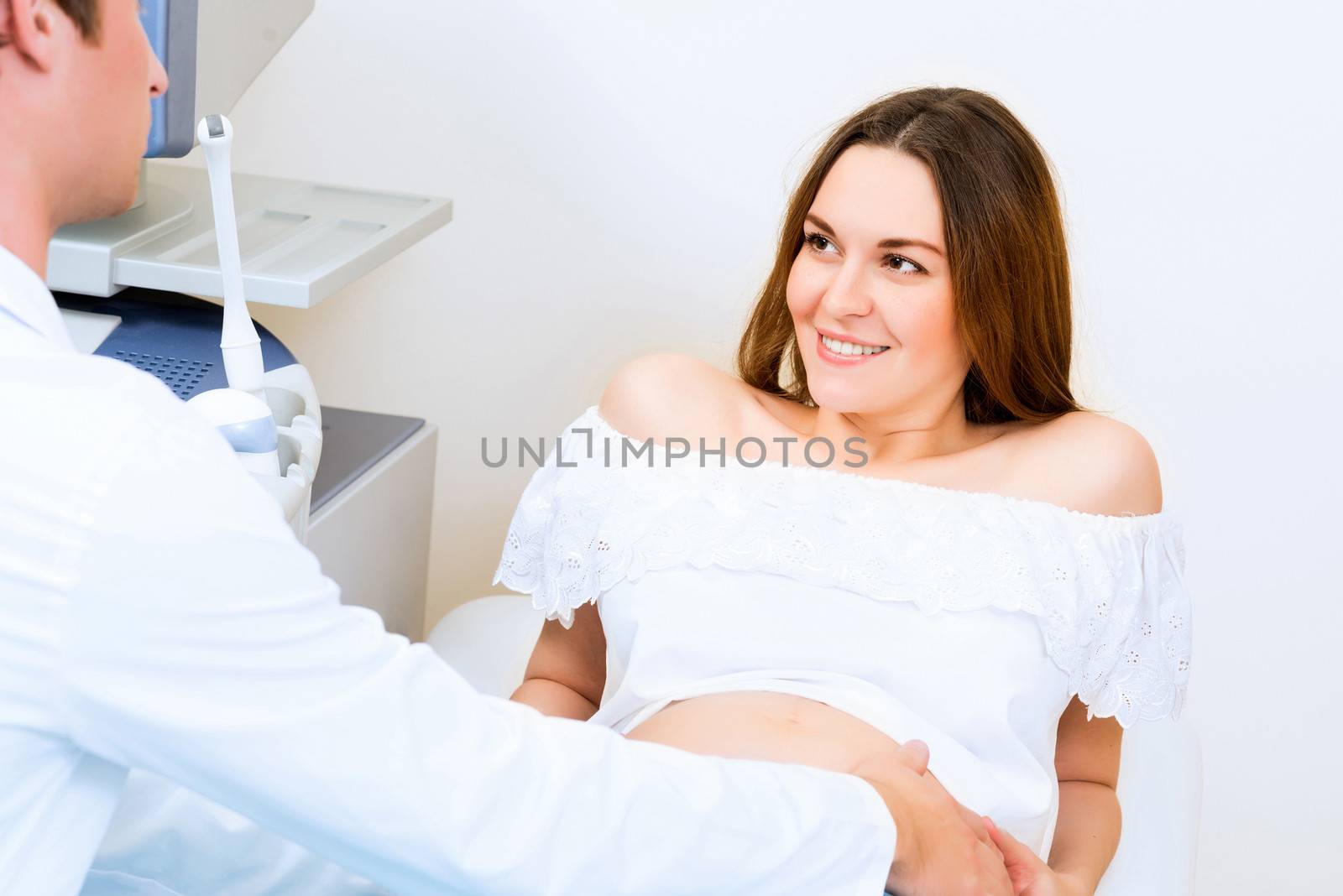 pregnant woman on reception at the doctor by adam121