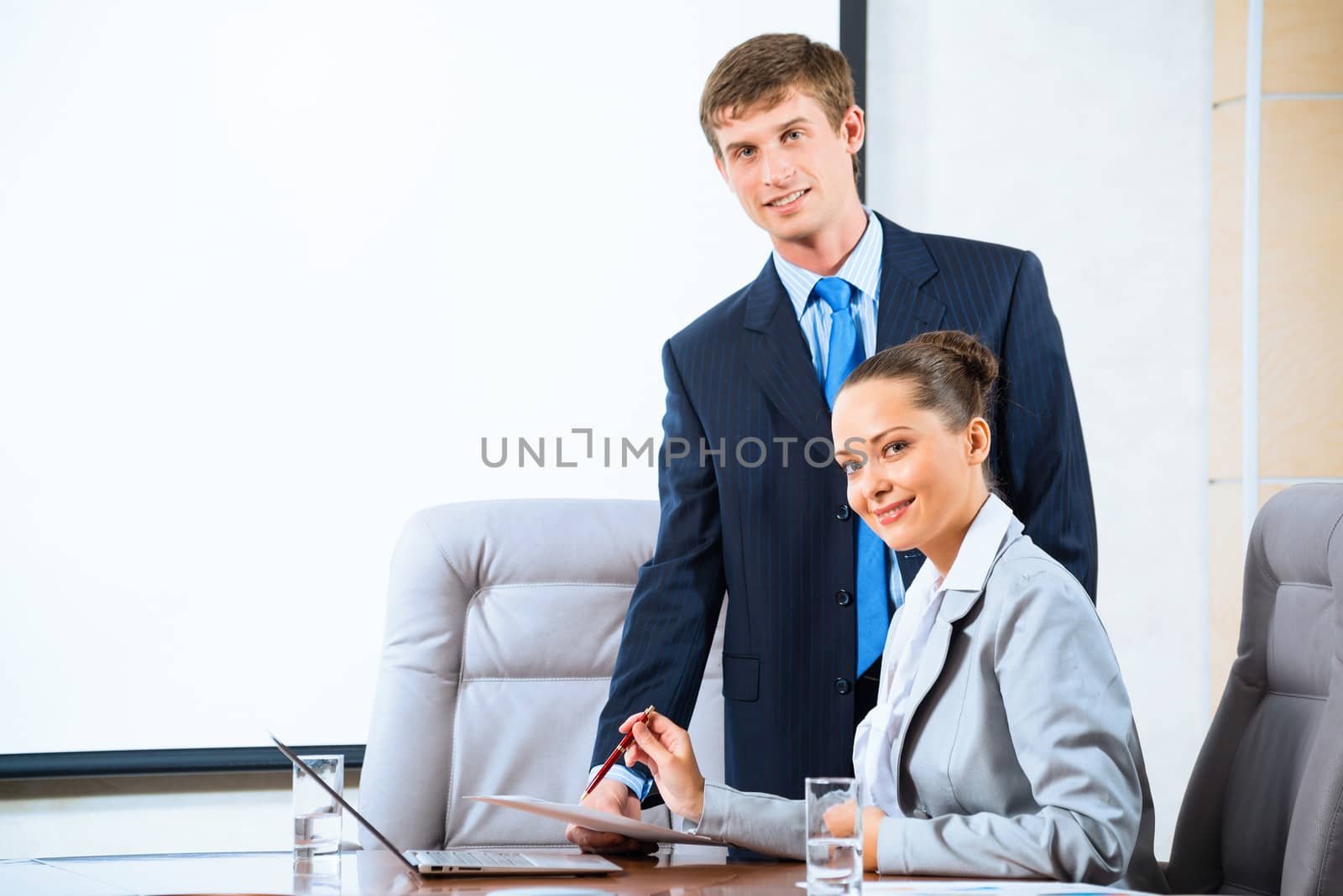 image of a two businessmen discussing documents, teamwork