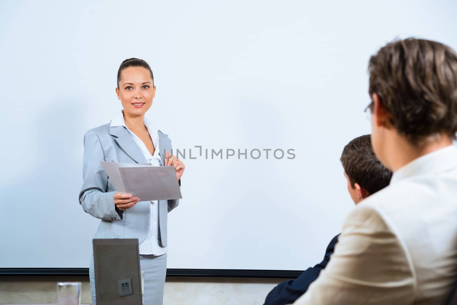 image of a discusses business woman with colleagues